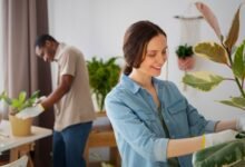 A couple taking care of a plant, showcasing the role of home design in stress and anxiety management