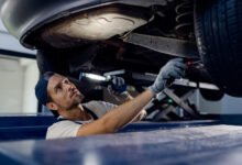 auto mechanic working on car A1 exhaust